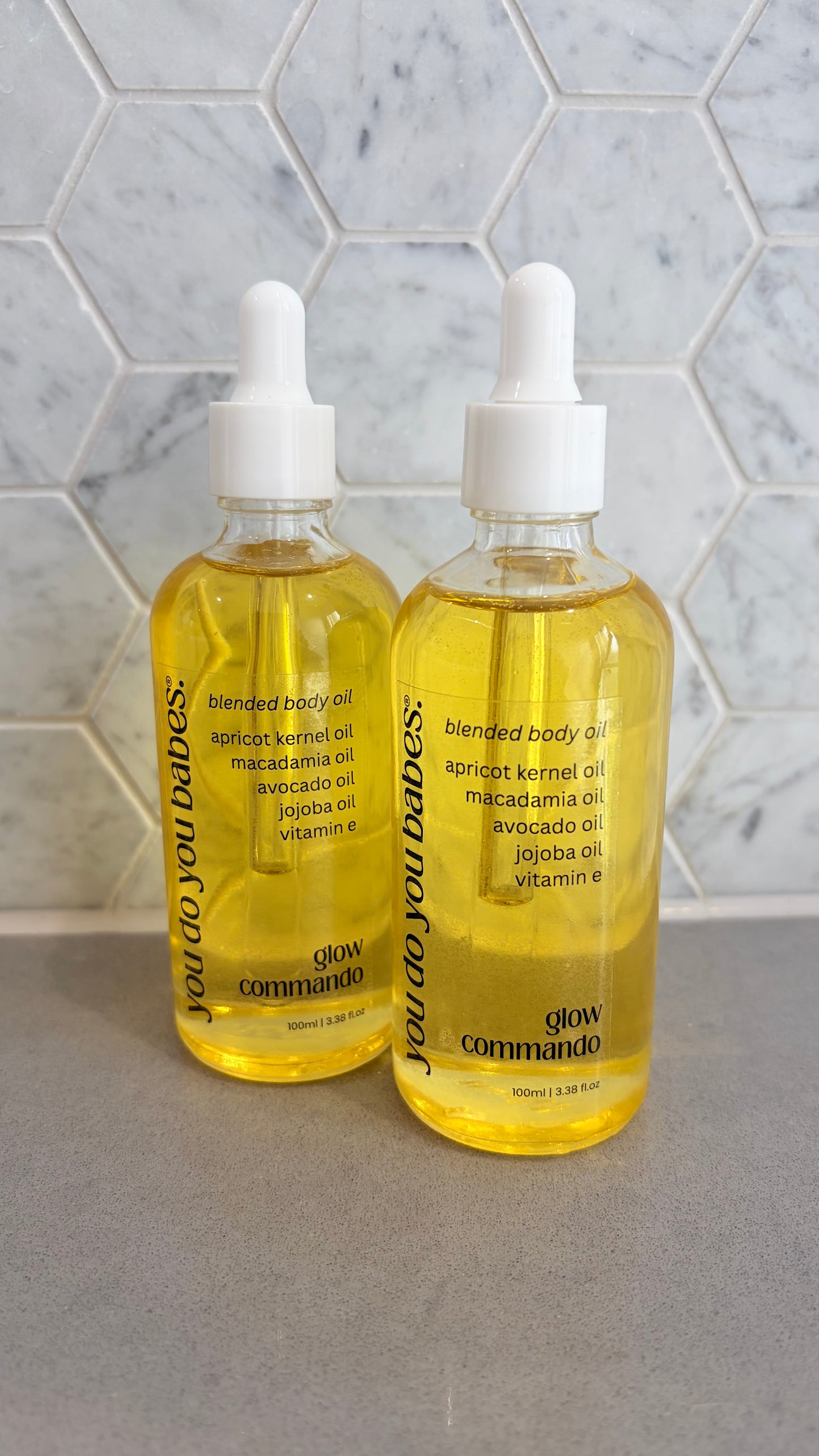 Two bottles of 'You Do You Babes’ blended body oil