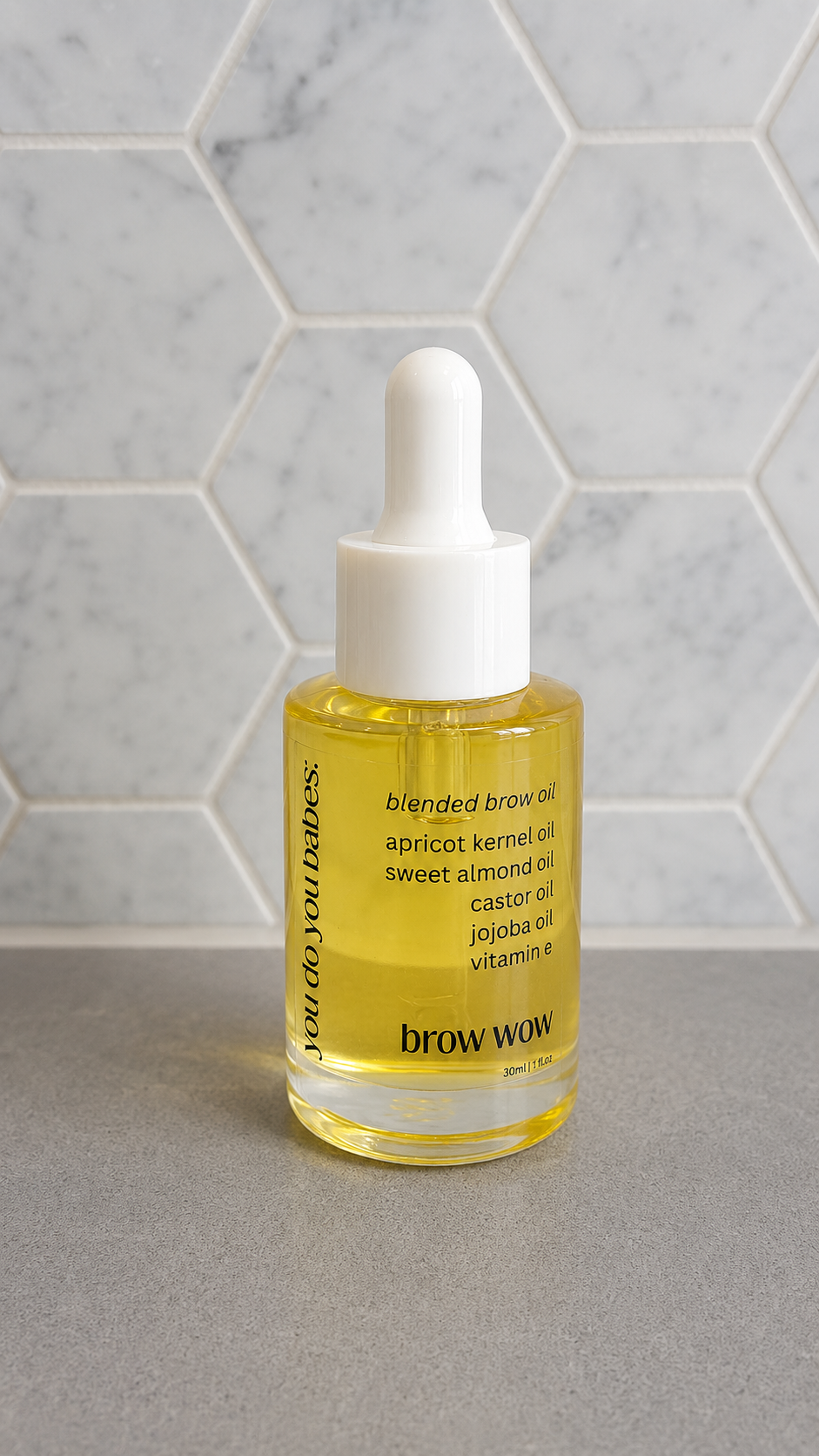 Bottle of brow oil with a dropper