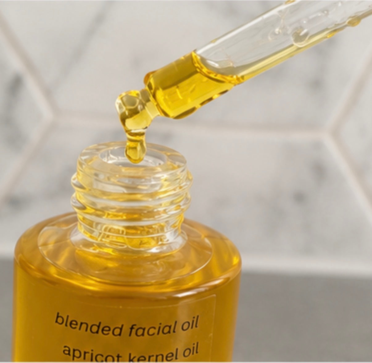 Gold oil in dropper bottle with blended facial oil