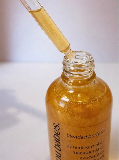 Bottle of shimmer body oil by you do you babes called honey trap 