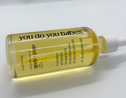 Bottle of 'oiled and spoilt.' blended body oil with text on a white background